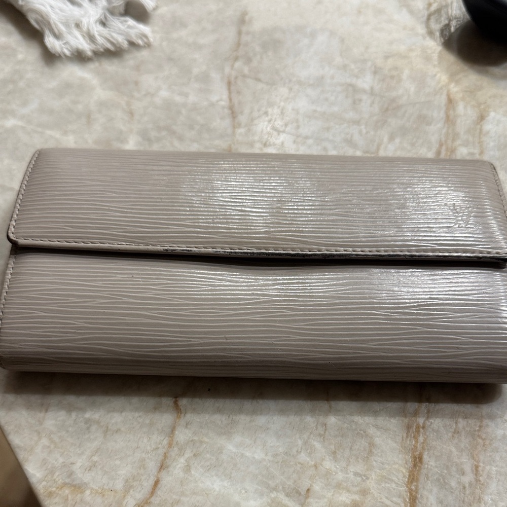 Louis Vuitton epi leather wallet in taupe.